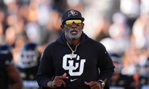 Aug 29, 2024; Boulder, Colorado, USA; Colorado Buffaloes head coach Deion Sanders runs onto the field before the game against the North Dakota State Bison at Folsom Field. Mandatory Credit: Ron Chenoy-USA TODAY Sports