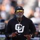 Aug 29, 2024; Boulder, Colorado, USA; Colorado Buffaloes head coach Deion Sanders runs onto the field before the game against the North Dakota State Bison at Folsom Field. Mandatory Credit: Ron Chenoy-USA TODAY Sports