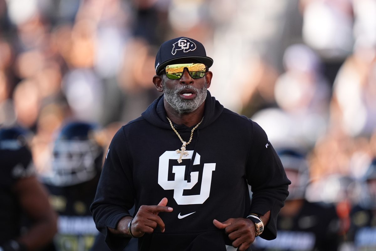 Aug 29, 2024; Boulder, Colorado, USA; Colorado Buffaloes head coach Deion Sanders runs onto the field before the game against the North Dakota State Bison at Folsom Field. Mandatory Credit: Ron Chenoy-USA TODAY Sports