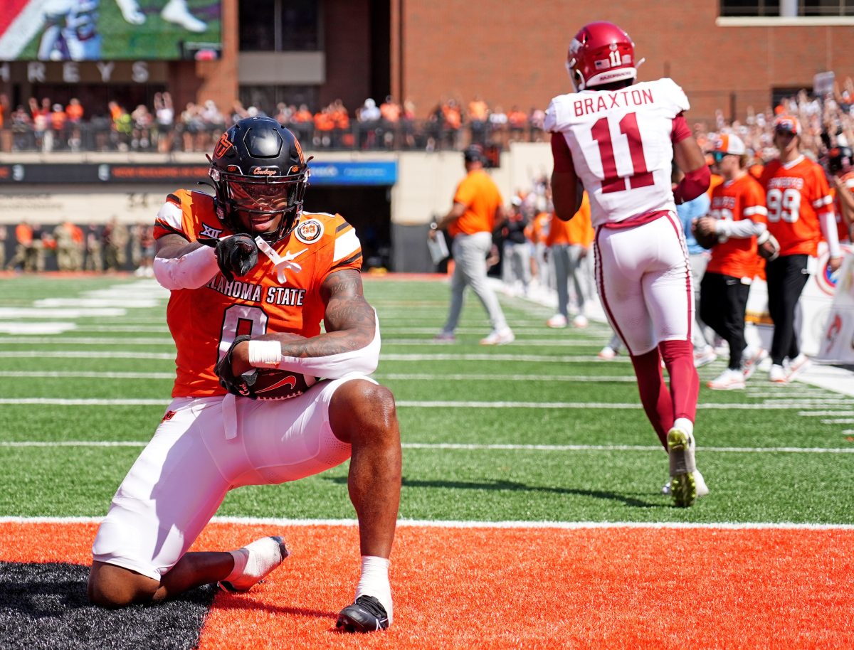 Oklahoma State's Ollie Gordon II (0) celebrates a 2-point conversion front of /tJaylon Braxton (11) in double overtime of the college football game between the Oklahoma State Cowboys and the Arkansas Razorbacks at Boone Pickens Stadium in Stillwater, Okla.,, Saturday, Sept., 7, 2024.