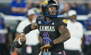 Sep 13, 2024; Kansas City, Kansas, USA; Kansas Jayhawks quarterback Jalon Daniels (6) throws a pass during the second half against the UNLV Rebels at Children's Mercy Park. Mandatory Credit: Jay Biggerstaff-Imagn Images